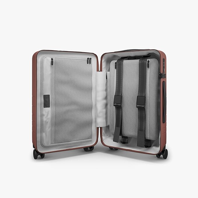 Monos Carry-On Pro Plus Luggage (23"), Hardside Spinner Suitcase with TSA Lock & Front Pocket, Airline Approved, Terracotta, Red