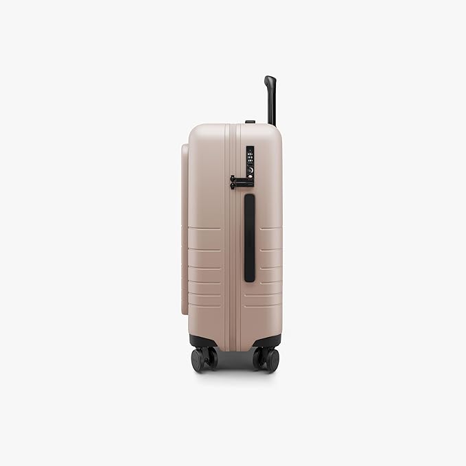 Monos Carry-On Pro Plus Luggage (23"), Hardside Spinner Suitcase with TSA Lock & Front Pocket, Airline Approved, Rose Quartz, Pink