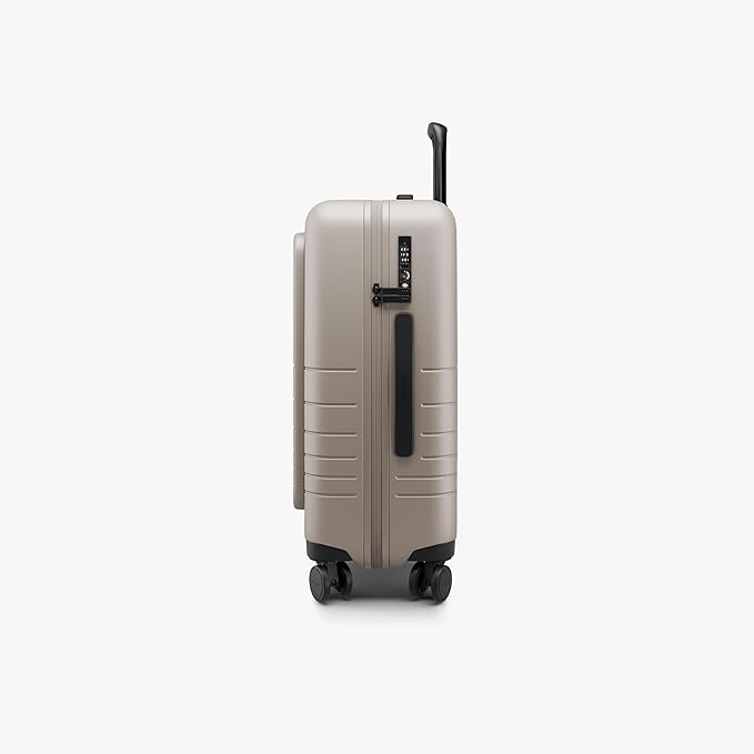 Monos Carry-On Pro Plus Luggage (23"), Hardside Spinner Suitcase with TSA Lock & Front Pocket, Airline Approved, Desert Taupe, Beige