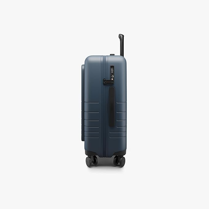 Monos Carry-On Pro Plus Luggage (23"), Hardside Spinner Suitcase with TSA Lock & Front Pocket, Airline Approved, Ocean Blue