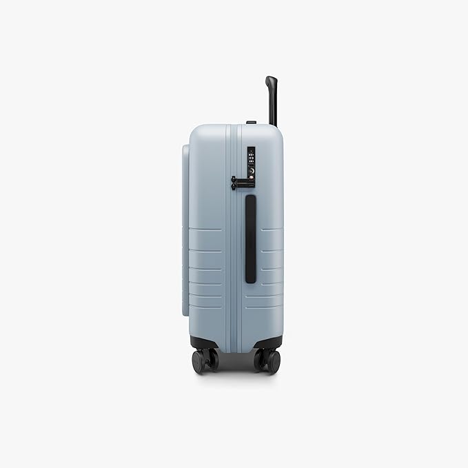 Monos Carry-On Pro Plus Luggage (23"), Hardside Spinner Suitcase with TSA Lock & Front Pocket, Airline Approved, Blue Haze
