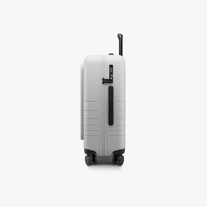Monos Carry-On Pro Plus Luggage (23"), Hardside Spinner Suitcase with TSA Lock & Front Pocket, Airline Approved, Stellar White