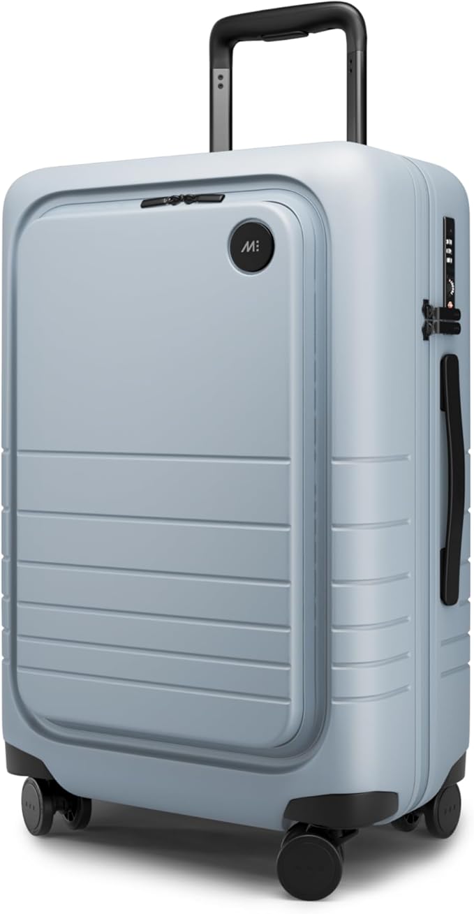 Monos Carry-On Pro Plus Luggage (23"), Hardside Spinner Suitcase with TSA Lock & Front Pocket, Airline Approved, Blue Haze