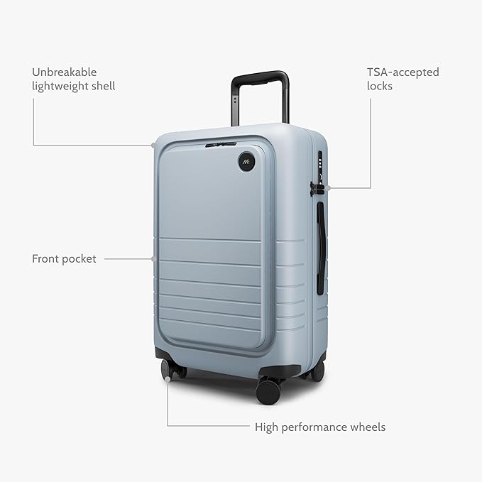 Monos Carry-On Pro Plus Luggage (23"), Hardside Spinner Suitcase with TSA Lock & Front Pocket, Airline Approved, Blue Haze
