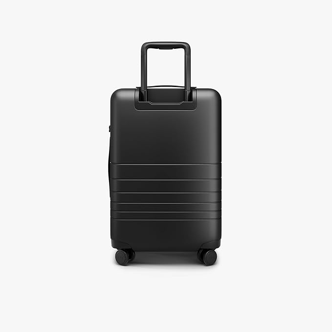 Monos Carry-On Pro Plus Luggage (23"), Hardside Spinner Suitcase with TSA Lock & Front Pocket, Airline Approved, Midnight Black