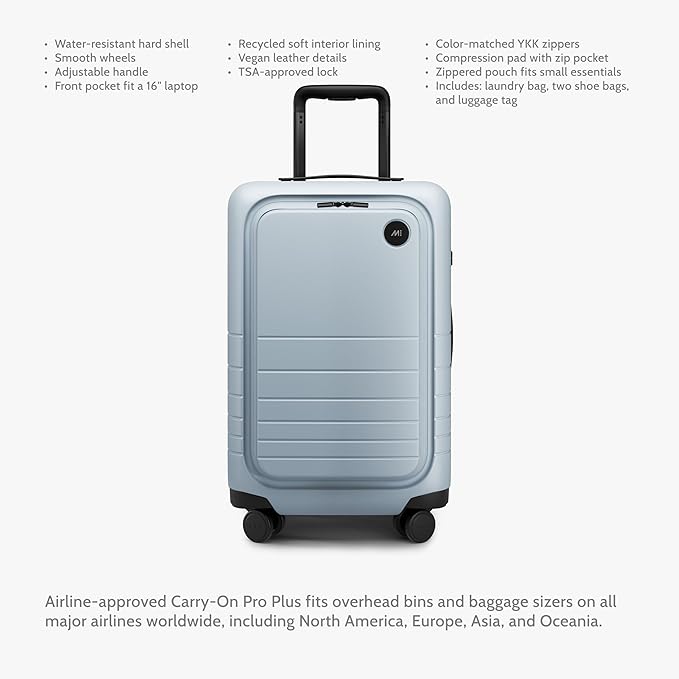 Monos Carry-On Pro Plus Luggage (23"), Hardside Spinner Suitcase with TSA Lock & Front Pocket, Airline Approved, Blue Haze