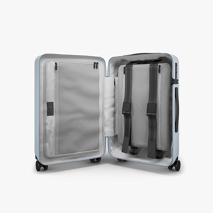 Monos Carry-On Pro Plus Luggage (23"), Hardside Spinner Suitcase with TSA Lock & Front Pocket, Airline Approved, Blue Haze