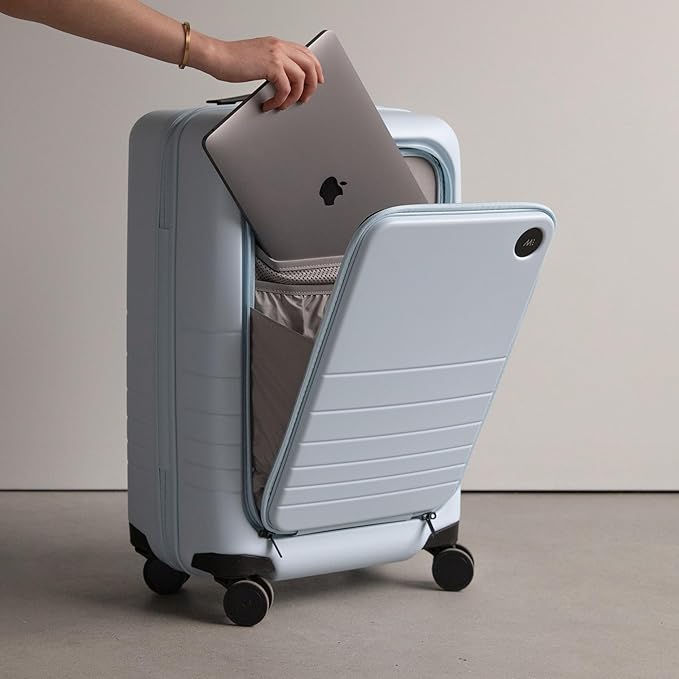 Monos Carry-On Pro Plus Luggage (23"), Hardside Spinner Suitcase with TSA Lock & Front Pocket, Airline Approved, Blue Haze