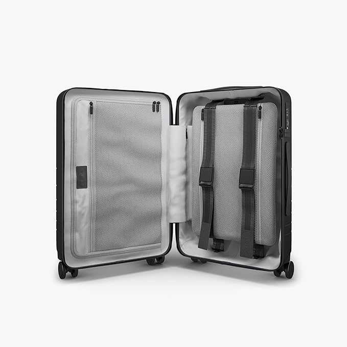 Monos Carry-On Pro Plus Luggage (23"), Hardside Spinner Suitcase with TSA Lock & Front Pocket, Airline Approved, Midnight Black