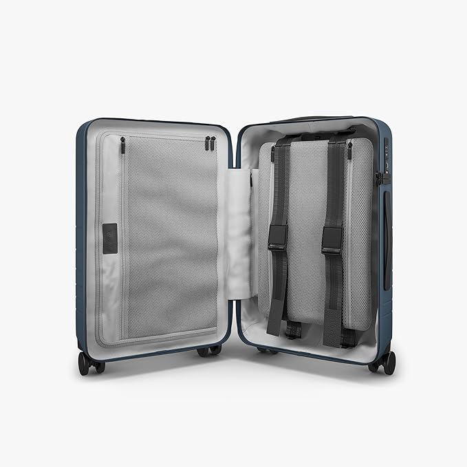 Monos Carry-On Pro Plus Luggage (23"), Hardside Spinner Suitcase with TSA Lock & Front Pocket, Airline Approved, Ocean Blue