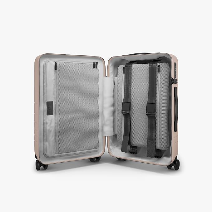 Monos Carry-On Pro Plus Luggage (23"), Hardside Spinner Suitcase with TSA Lock & Front Pocket, Airline Approved, Rose Quartz, Pink