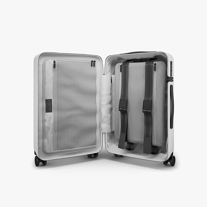 Monos Carry-On Pro Plus Luggage (23"), Hardside Spinner Suitcase with TSA Lock & Front Pocket, Airline Approved, Stellar White