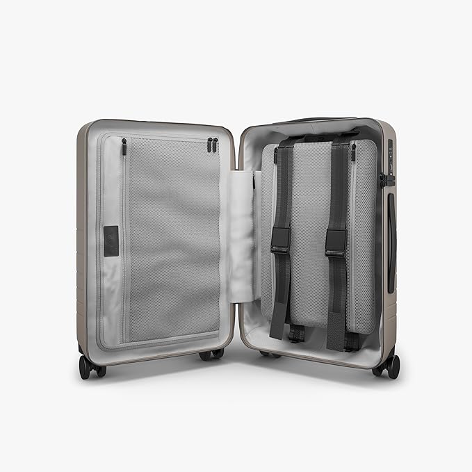 Monos Carry-On Pro Plus Luggage (23"), Hardside Spinner Suitcase with TSA Lock & Front Pocket, Airline Approved, Desert Taupe, Beige